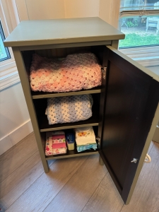 Secondary image for the Acadia Pear Cabinet Filled with Baby Items Auction Item