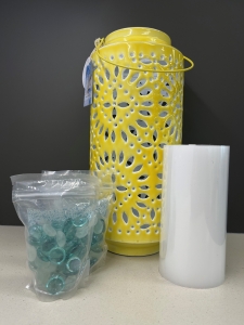 Secondary image for the 159 - Metal Lantern with Candle and Decorative Rocks Auction Item